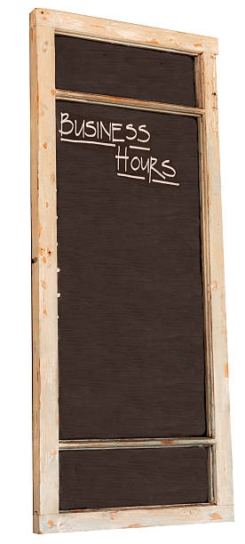 Blank blackboard with business hours caption stock photo