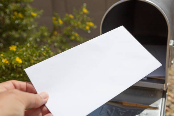 Blank Envelope in Mailbox stock photo