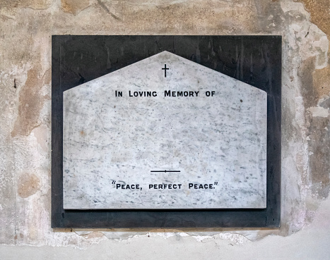 Old marble memorial plaque inside a church; it has had the name and details removed so that text of your choice can be added.