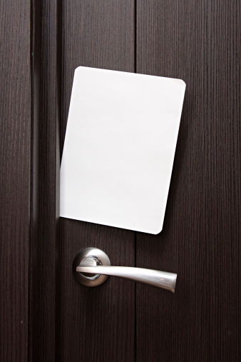 Blank Paper To Write Nested In Gap Under Wooden Door Stock
