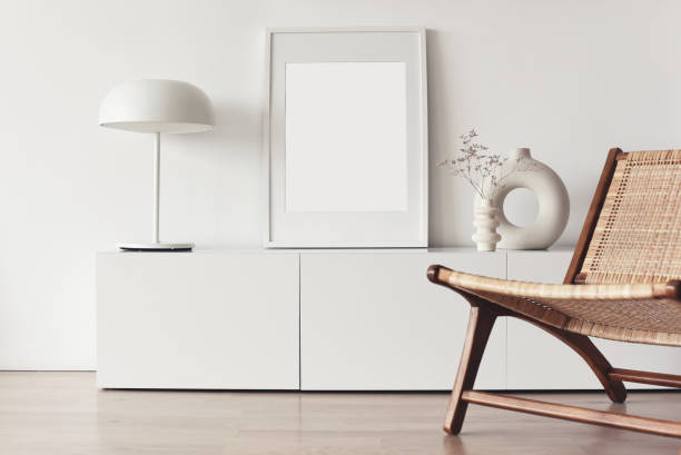 Blank picture frame mockup on white wall. Living room design stock photo