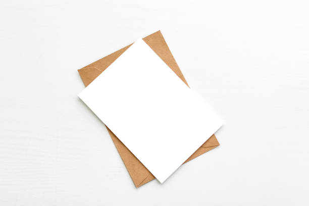 Blank postcard, postcard with soft shadows Hello winter. Blank white postcard postcard flyer on a grey background envelope photos stock pictures, royalty-free photos & images