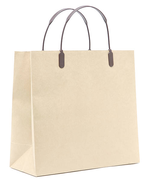 Blank, unlabeled, cream colored paper shopping bag stock photo