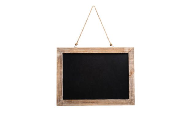 Blank vintage chalkboard with wooden frame and rope for hanging, isolated on white background stock photo