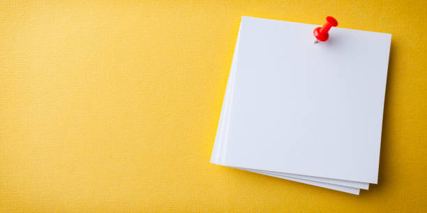 Blank white paper note pad reminder sticky notes on cork bulletin board. Empty space for text. Office equipment. Blank white paper note pad reminder sticky notes on cork bulletin board. Empty space for text. Office equipment. reminder stock pictures, royalty-free photos & images