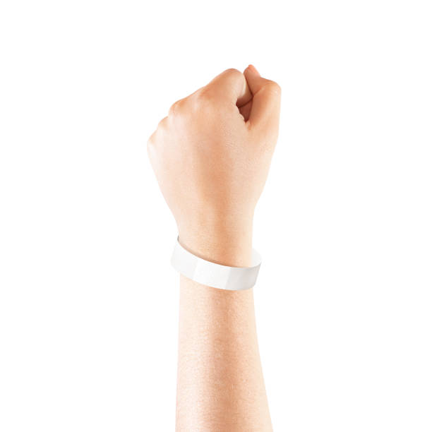 Blank white paper wristband mock up on persons arm Blank white paper wristband mock up on persons arm. Empty event wrist band design mockup on hand. Cheap bracelets template, isolated. Clear adhesive bangle wristlet with sticker. Concert armlet bracelet stock pictures, royalty-free photos & images