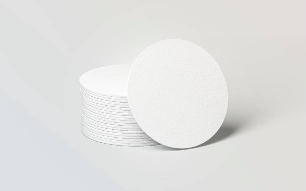 Blank white round beer coasters stack mockup Blank white round beer coasters stack mockup, 3d rendering. Empty circle mat for drink mock up. Clear coster pedestal for can or bottle. Pile of rug for beverage template. coaster stock pictures, royalty-free photos & images