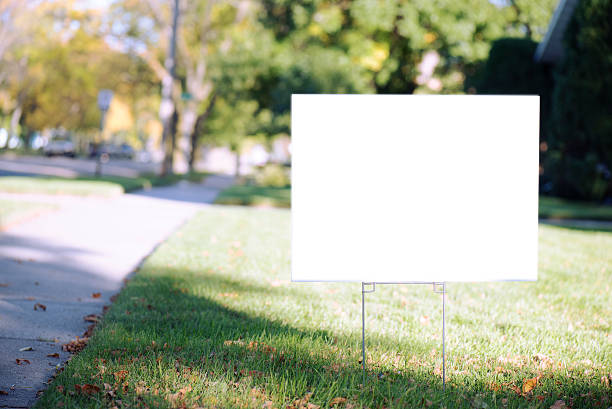 blank yard sign with copy space during fall white sign with clipping path on front lawn during sunny day. sign stock pictures, royalty-free photos & images
