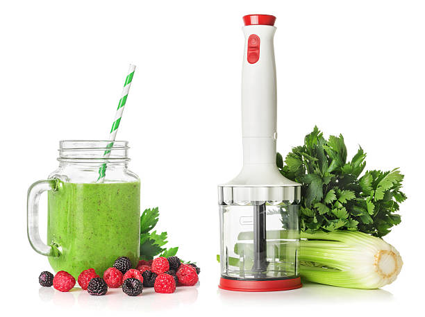 Blender, stems and leaves of celery for green smoothies stock photo