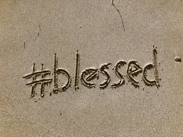 Blessed Message Written in Sand stock photo