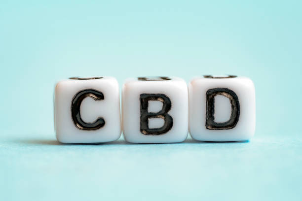Blocks with word CBD on blue background. Cannabis, marijuana, hemp. Medical concept of cannabidiol cbd benefits stock pictures, royalty-free photos & images