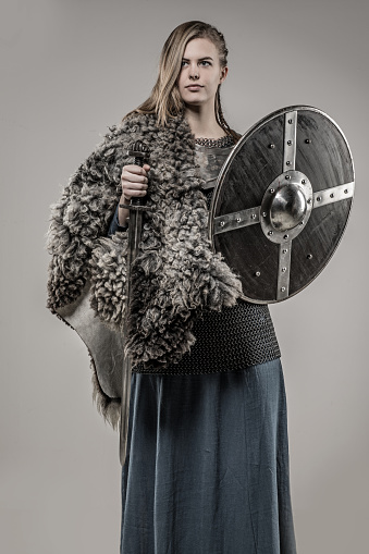 Portrait Of Blonde Viking Warrior Female Holding A Sword 