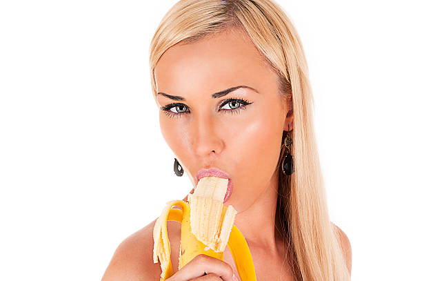 blond woman sexy eats banana - sucking banana stock photos and pictures.