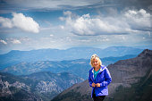 istock Blond woman standing on Imogene Pass, Colorado 1018789276