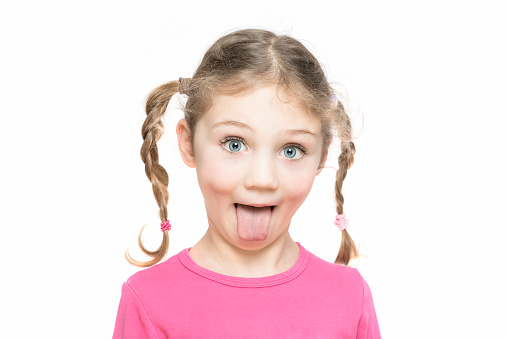 Blonde Girl With Pigtails Show Her Tongue Stock Photo -4236