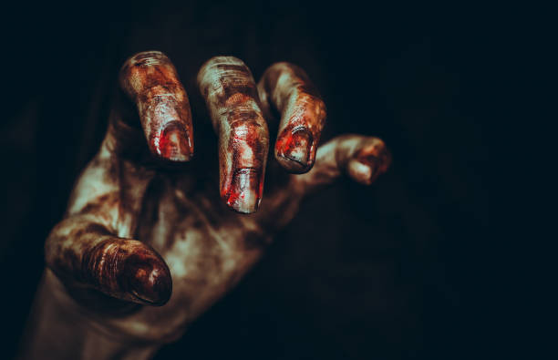 Bloody dirty zombie hand on black background. Halloween spooky poster Bloody dirty zombie hand on black background with copy space. Halloween spooky poster evil photos stock pictures, royalty-free photos & images