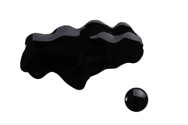 Blot of nai lpolish. Spilled black nailpolish isolated on white. Woman cosmetic fashion product. Blot of nai lpolish. Spilled black nailpolish isolated on white. Woman cosmetic fashion product. Nail varnish sample. Finger makeup beauty cosmetic spread. Squiggly sparkly cosmetic enamel. Macro lacquered stock pictures, royalty-free photos & images