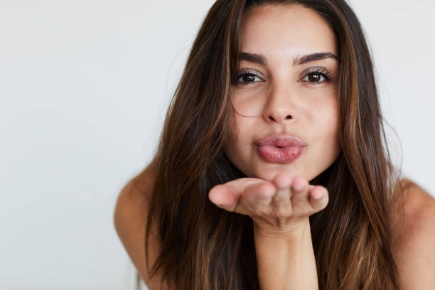 Blowing kiss babe stock photo