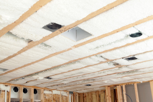 Blown Insulation Installed Between House Floor Joists Stock