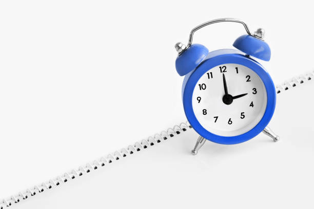 Blue alarm clock close up Blue alarm clock close up daylight savings time 2021 stock pictures, royalty-free photos & images