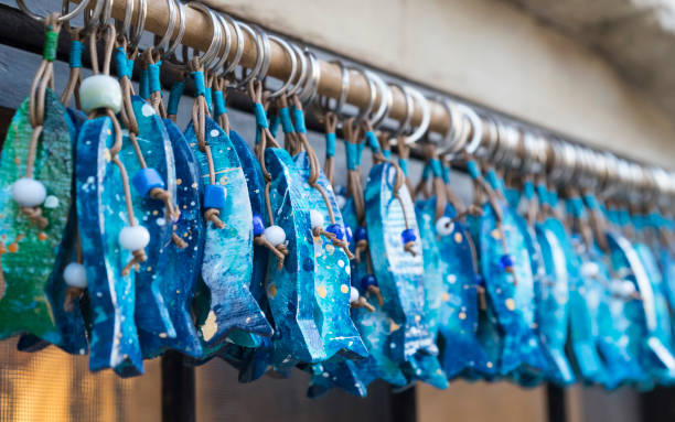 Blue and Green Fish Key Rings in a Row stock photo