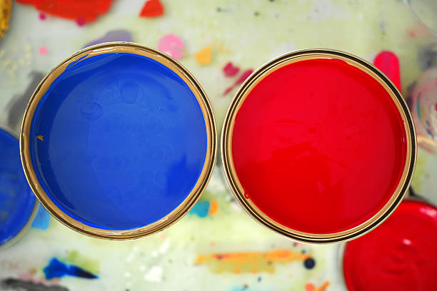 Blue And Red Paint Cans Top View stock photo