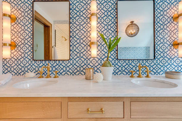 Blue and white patterned tile in bathroom with natural wood stock photo