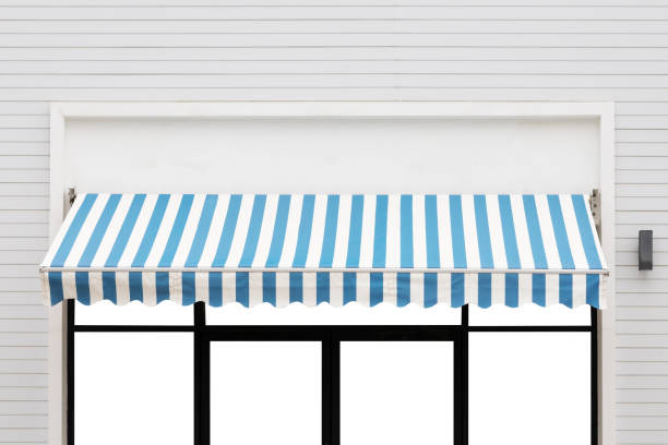 blue and white striped awning of bank shop. exterior outdoor canvas roof.  awning window stock pictures, royalty-free photos & images