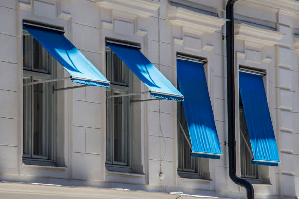 Blue awning , window  awning window stock pictures, royalty-free photos & images