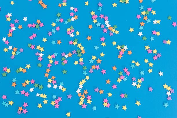 blue background with embossed colored stars texture stock photo