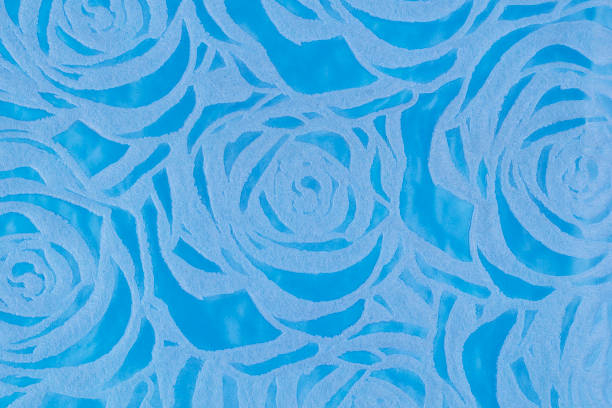 blue background with embossed roses texture stock photo