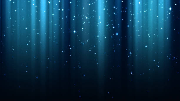 Blue background with rays of light, sparkles, northern lights, night starry sky stock photo