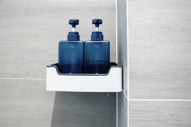 Blue bottle bath fluid in a clean and comfortable bathroom stock photo
