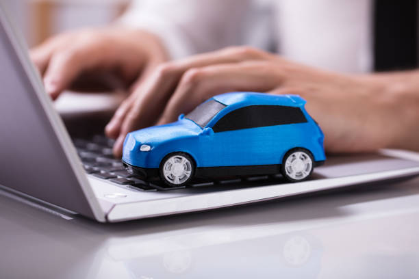 Blue Car On Laptop Keypad  car buy stock pictures, royalty-free photos & images