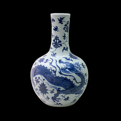 blue ceramic porcelain vase on isolated black background