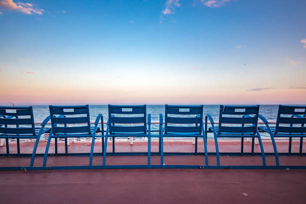 Blue chairs on the Promenade des Anglais in Nice France stock photo