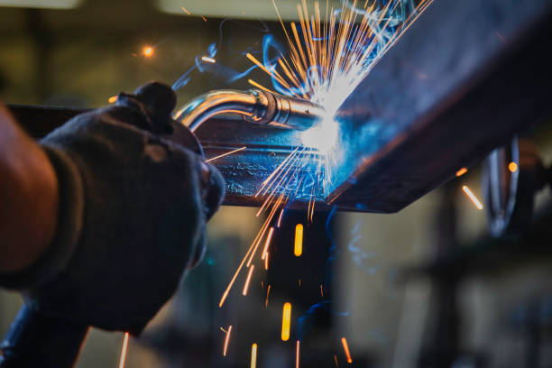 Blue Collar Workers- metal welder stock photo