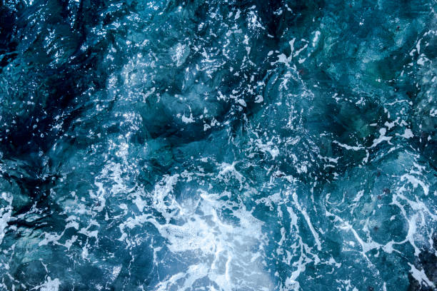 Blue deep sea foaming water background stock photo