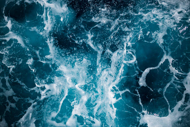Blue deep sea foaming water background stock photo