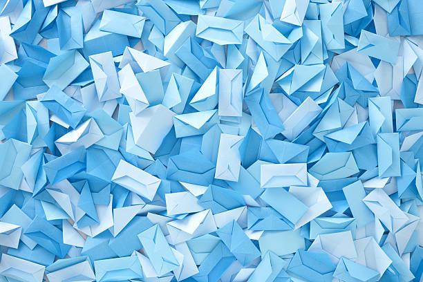Blue envelopes Lots of empty paper origami handmade envelopes in blue shades for communication concept envelope photos stock pictures, royalty-free photos & images