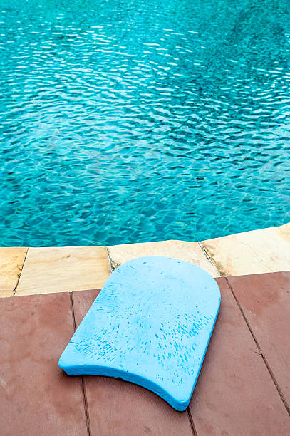 Blue foam board for the teaching Blue foam board for the teaching of swimming beside swimming pool foamcore stock pictures, royalty-free photos & images