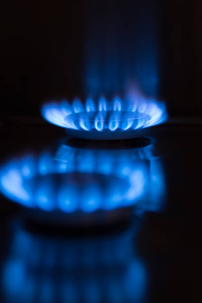 blue gas flame black background stock photo
