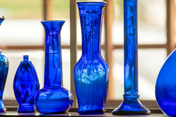 Blue Glass Vases on a Shelf. stock photo