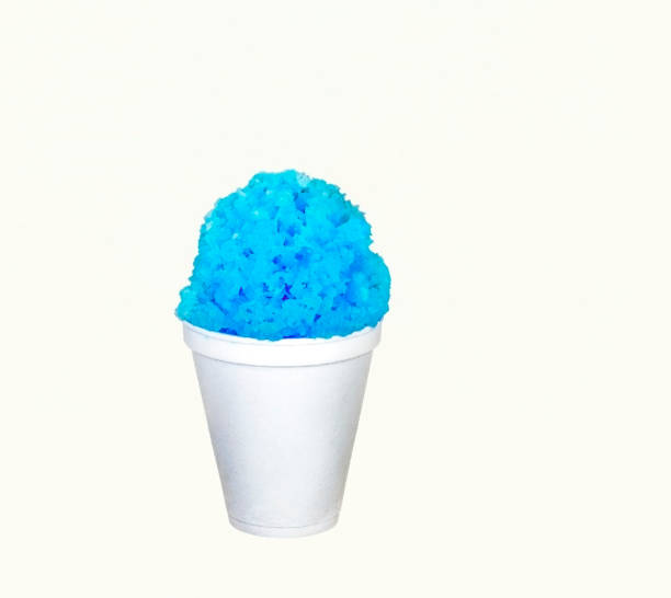 Blue Hawaiian shave ice, shaved ice or snow cone in a white cup on a white background. stock photo