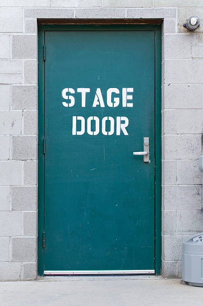 Blue isolated stage door on brick wall stock photo