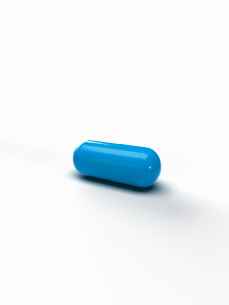 Blue medicine pill capsule. stock photo