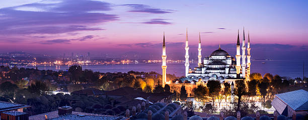 Blue Mosque at Night in Istanbul Turkey Panoramic view of the Blue Mosque and the Sultanahmet district of Istanbul, Turkey at twilight. blue mosque stock pictures, royalty-free photos & images