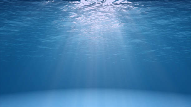 Blue ocean surface seen from underwater stock photo