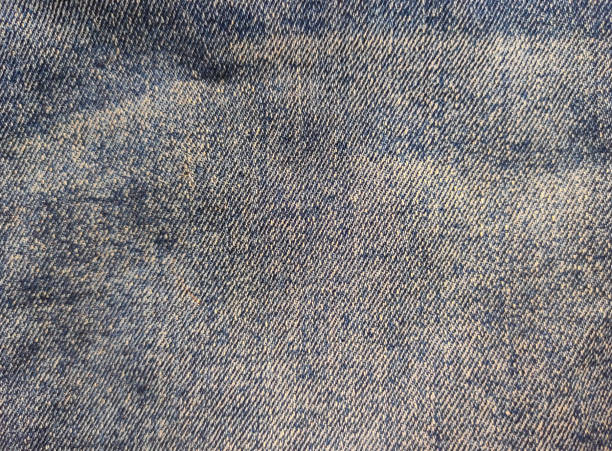 Blue old jeans. View from above. Fabric texture. Close-up, fashion concept. Empty space, place for text. Copy space. stock photo