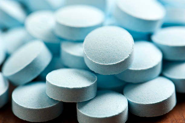 Blue Pills Heap of Blue pills close up anti impotence tablet stock pictures, royalty-free photos & images
